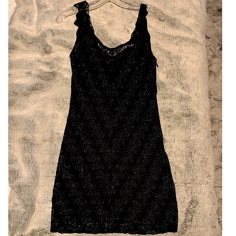 Free people black mini dress. size (m) Little pops of silver and lace.